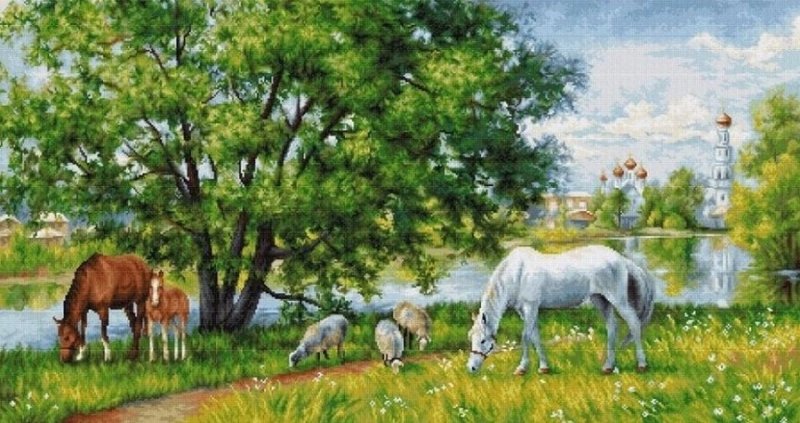Лошади под деревом у реки
